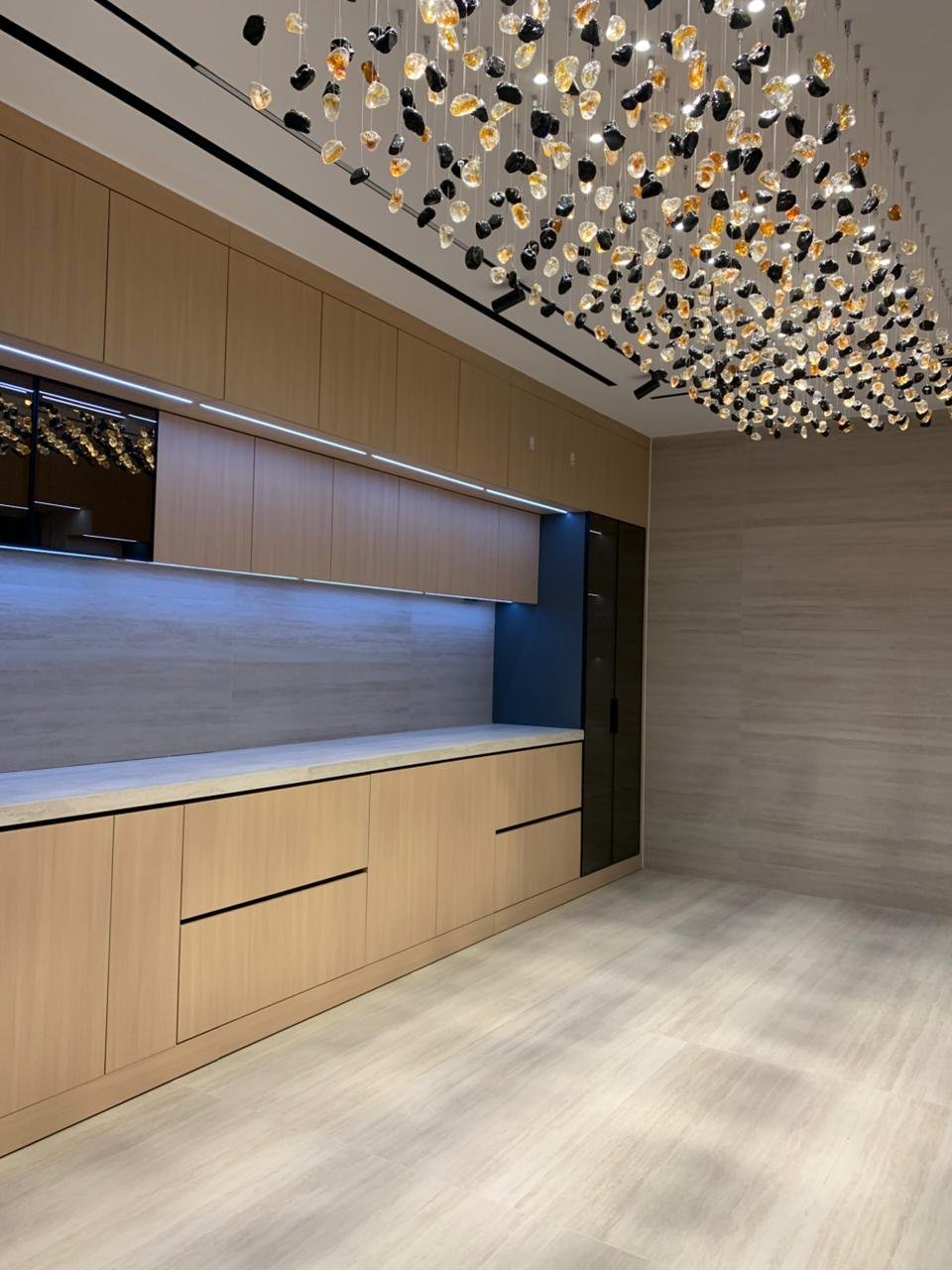 Ceiling detailing around a feature chandelier