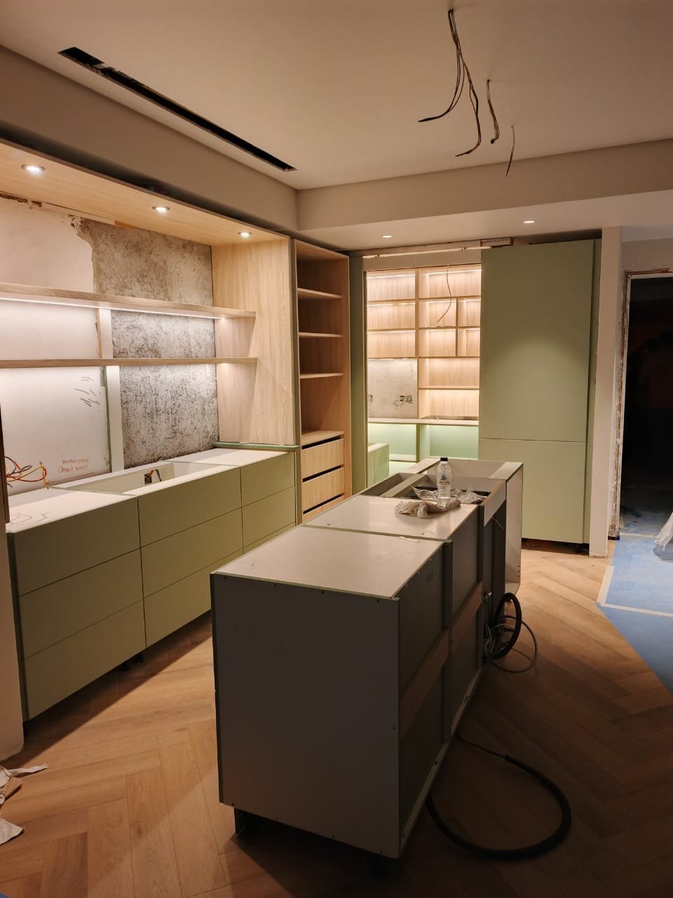 Sage kitchen island and open shelving